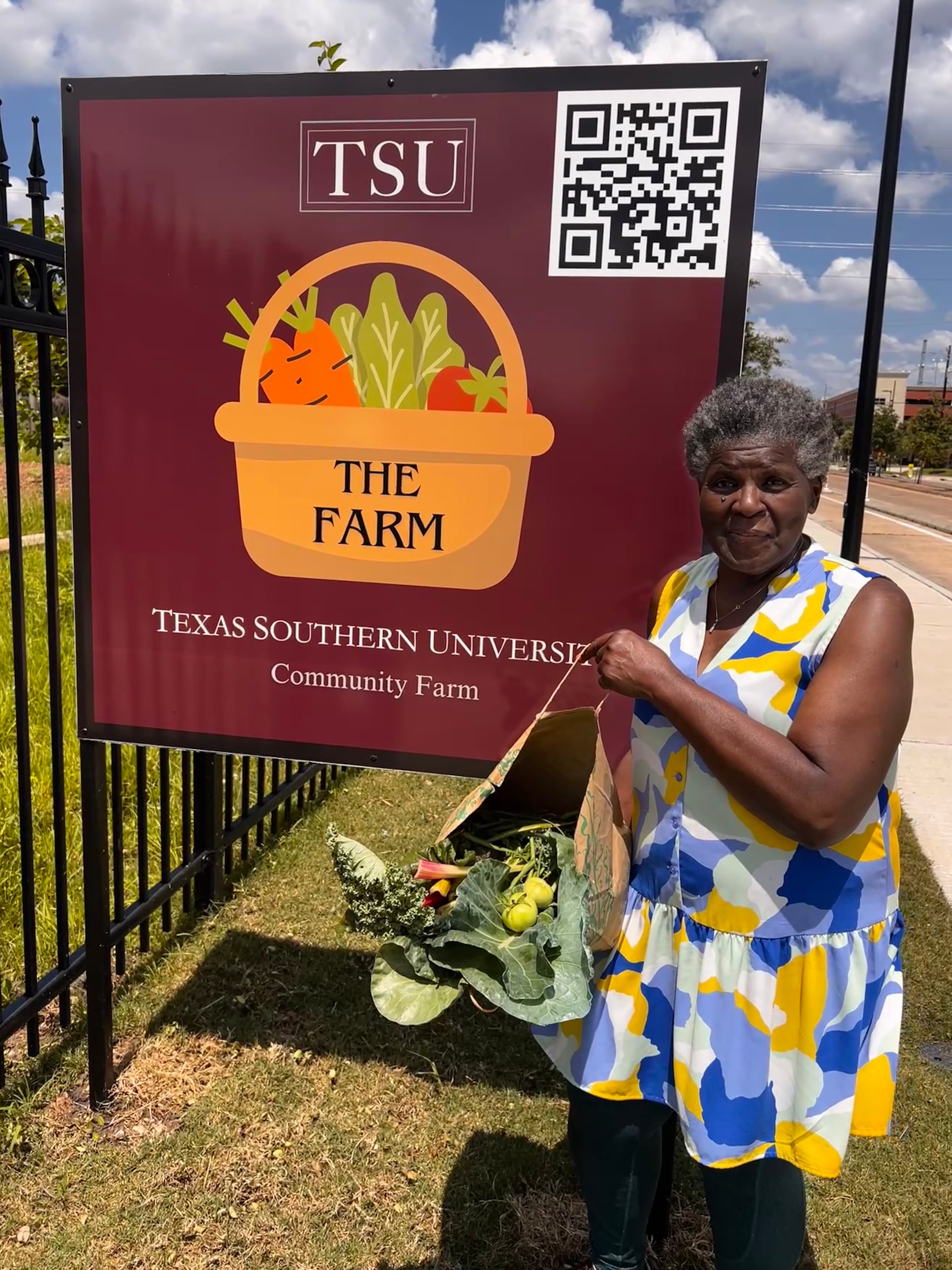 Community member with fresh produce from the farm